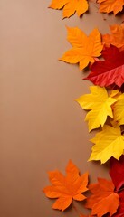 Poster - A collection of vibrant autumn leaves in shades of orange, yellow, and red are arranged diagonally across a brown background, creating a visually striking and seasonal display