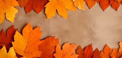 Poster - A collection of autumn leaves in various shades of orange, yellow, and red arranged in a frame against a beige background