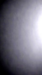 Poster - a blurred, dark gray background with no discernible text or objects