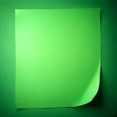 Aufkleber - A green paper sheet is slightly curled, resting against a dark green background