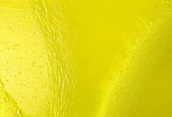 Poster - a close-up view textured surface with a vibrant yellow hue, featuring a subtle pattern of lines and droplets