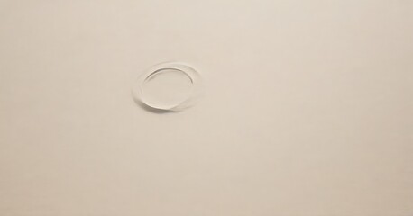 Poster - A single, circular hole is centered in a light beige background