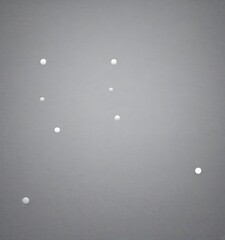Poster - a group of white circles floating in a gray sky, with one slightly larger circle in the bottom right corner