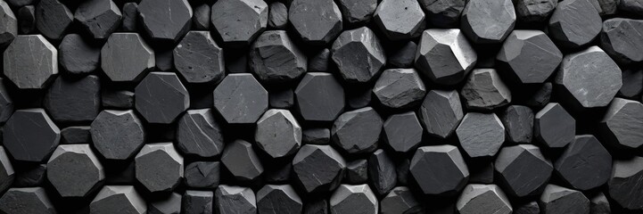 Poster - A close-up view textured surface composed of numerous dark gray, octagonal-shaped stones or blocks arranged in a grid-like pattern