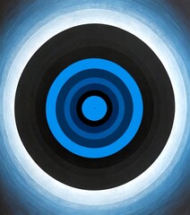 Poster - a circular design with concentric blue and black concentric circles, creating a visually striking and abstract pattern