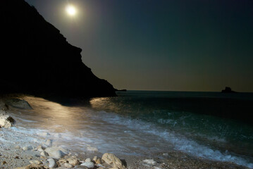 Wall Mural - moon night landscape on sea with waves and rocks