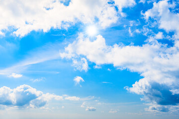 Wall Mural - Blue sky and clouds with sun rays, sky background