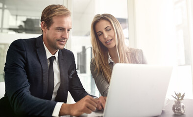 Wall Mural - Man, woman and laptop on office for business, meeting and advice for company growth. People, computer and discussion in workplace for teamwork, brainstorming or budget planning for financial year end