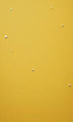 Fototapete - a yellow wall with small white dots scattered across it, creating a sense of randomness and movement