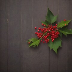 Poster - A branch of red berries and green leaves rests on a dark wooden surface, creating a striking contrast between the vibrant red and the muted brown tones