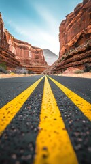 Poster - A road with yellow lines and a mountain in the background