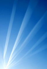 Aufkleber - a clear blue sky with sunbeams radiating outwards, creating a sense of depth and dimension