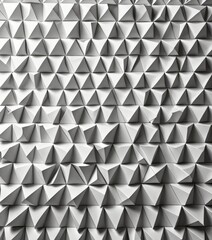 Poster - A repeating pattern of white triangles arranged in a grid-like fashion, creating a visually striking geometric design