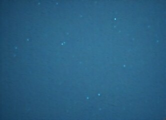 Poster - a deep blue body of water with small white specks scattered throughout, creating a sense of movement and depth.