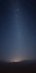 Leinwandbilder - The Milky Way galaxy stretches across the night sky, its spiral arms curving gracefully, with a faint glow of the setting sun visible in the distance