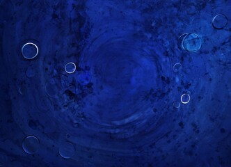 Fototapete - a dark blue background with scattered white and blue circles, creating a sense of movement and depth