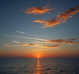 Poster - A breathtaking sunset over the ocean, with vibrant orange and yellow hues reflecting on the calm waters