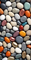 Aufkleber - A close-up image of a variety of colorful pebbles and stones arranged in a visually appealing pattern against a dark background.