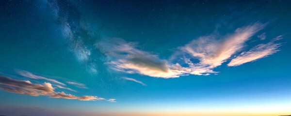 Poster - A breathtaking night sky unfolds with a vibrant display of clouds and the Milky Way galaxy, set against a gradient backdrop of orange and blue hues