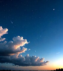 Poster - A starry night sky with a few wispy clouds and a shooting star streaking across the frame
