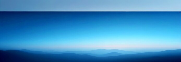 Aufkleber - a serene landscape with a clear blue sky and a hazy, mountainous terrain below The mountains appear to be in a state of transition, with the peaks appearing to be in a