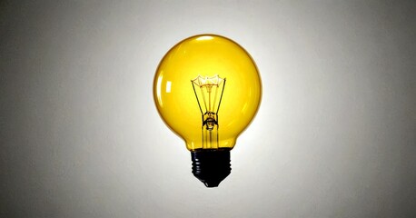 Poster - A single, glowing yellow light bulb with a black base and a black cord is suspended against a gray background