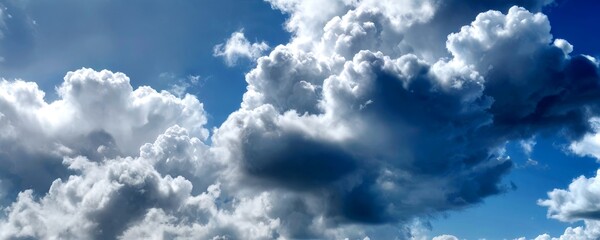 Poster - A vast expanse of fluffy white clouds fills the sky, creating a serene and tranquil atmosphere