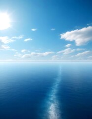 Poster - A serene vast, calm ocean under a clear blue sky with scattered clouds, captured from a high vantage point