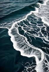 Poster - The captures the dynamic movement of ocean waves, with the crest wave breaking over the dark blue-green water, creating a striking contrast against the deep