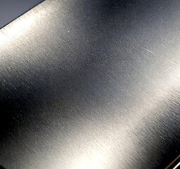 Fototapete - A close-up shiny, metallic surface with a reflective, metallic sheen