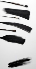Poster - Five different brush strokes in black paint are arranged in a vertical line against a white background