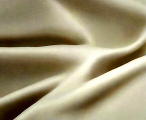 Aufkleber - a close-up view white fabric, likely silk, with a smooth, flowing texture The fabric appears to be crumpled, creating a sense of movement and softness The does