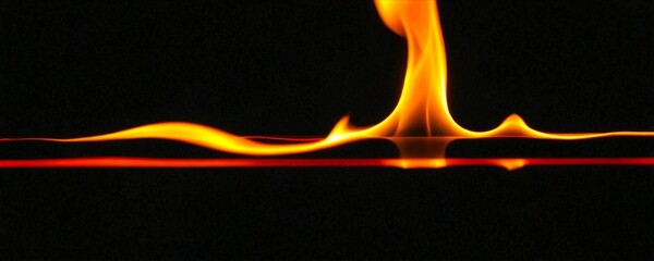 Aufkleber - A close-up view vibrant orange flame, with a reflection on a dark surface, creating a dynamic and captivating visual effect