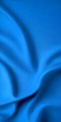 Poster - a close-up view blue fabric, with a blurred background that appears to be a gradient of blue, transitioning from a darker shade at the top to a lighter one at the bottom