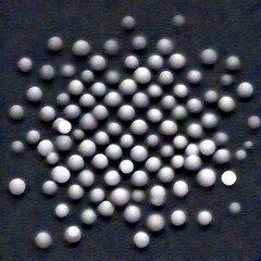 Leinwandbilder - a collection of white spheres scattered across a gray background, creating a visually striking and abstract composition