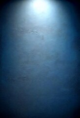 Leinwandbilder - a dark, textured wall with a single light source shining down from the top left corner, creating a dramatic contrast against the dark background