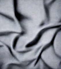 Aufkleber - A close-up view black fabric surface, with a subtle texture and folds, creating a sense of depth and movement