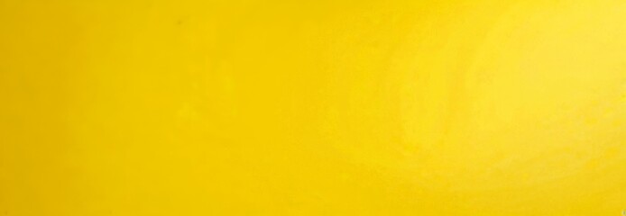 Aufkleber - a yellow surface, possibly a fabric or a painting, with a subtle gradient effect.