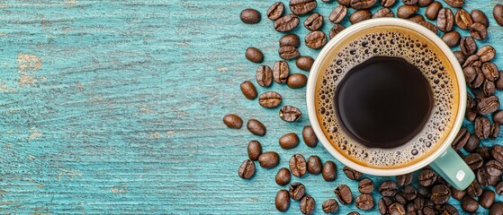 Wall Mural -  A cup of coffee against a backdrop of roasted beans on a blue tabletop - ideal for text inscription