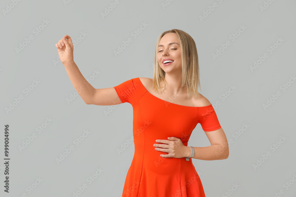 Happy pregnant woman on light background
