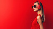 © LK  - Beautiful girl wearing headphones and listening to music on red background with copy space, banner template. Concept of listening to music. .