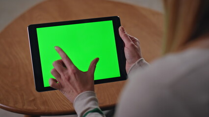 online customer zooming chroma key tablet shopping remotely at home close up.