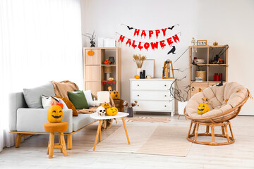 Poster - Interior of light living room decorated for Halloween with sofa, armchair and shelf units