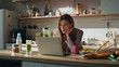 © stockbusters - Girl freelancer working kitchen enjoying hot coffee. Online student studying