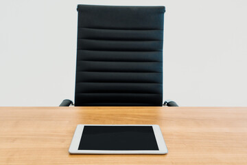 Tablet computer and chair at office table. Business concept. uds