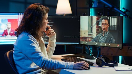 Woman doing software debugging helped by coworker in videocall, checking errors in lines of code. Programmer working from home fixing coding mistakes, assisted by colleague in teleconference, camera A