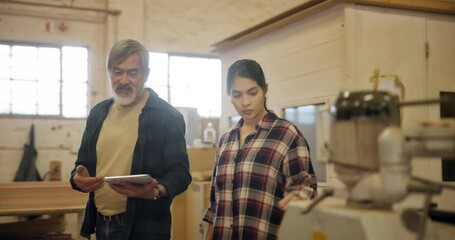 Sticker - Teamwork, carpenter and tablet in factory, apprentice and planning furniture manufacturing. Mentorship, warehouse and maintenance discussion, teaching and learning with touchscreen for work project