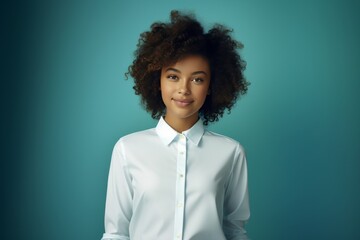 A Black woman with natural curly hair and a bright smile in a white shirt radiates charm and individuality, perfect for lifestyle and fashion campaigns.