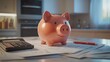 © Saha165 - a piggy bank sitting on top of a pile of financial