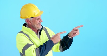 Poster - Pointing, smile and face of construction worker in studio with mockup space for building option or decision. Hardhat, portrait and foreman with presentation gesture for choice by blue background.